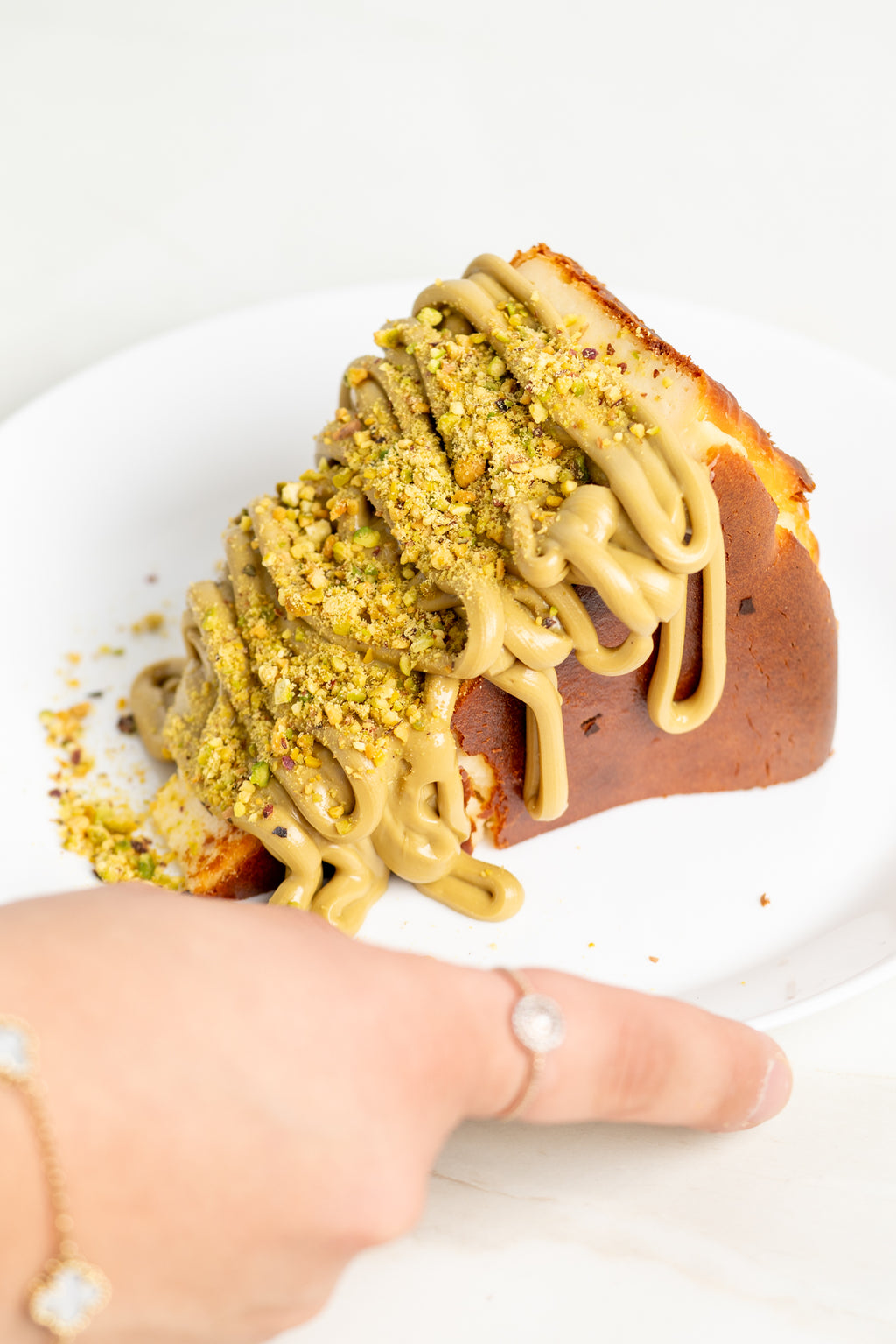Viral Burnt Basque Cheesecake slice + Pistachio Sauce