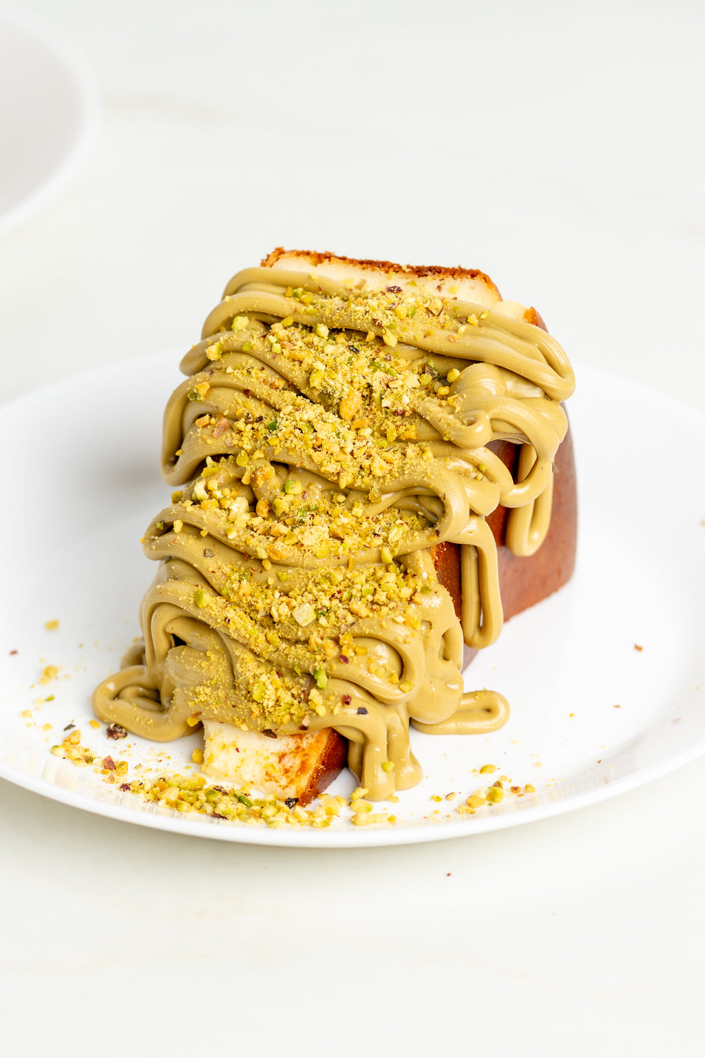 Viral Burnt Basque Cheesecake slice + Pistachio Sauce